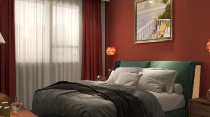 Modern bedroom featuring red walls dark grey bedding green headboard framed painting and red curtains