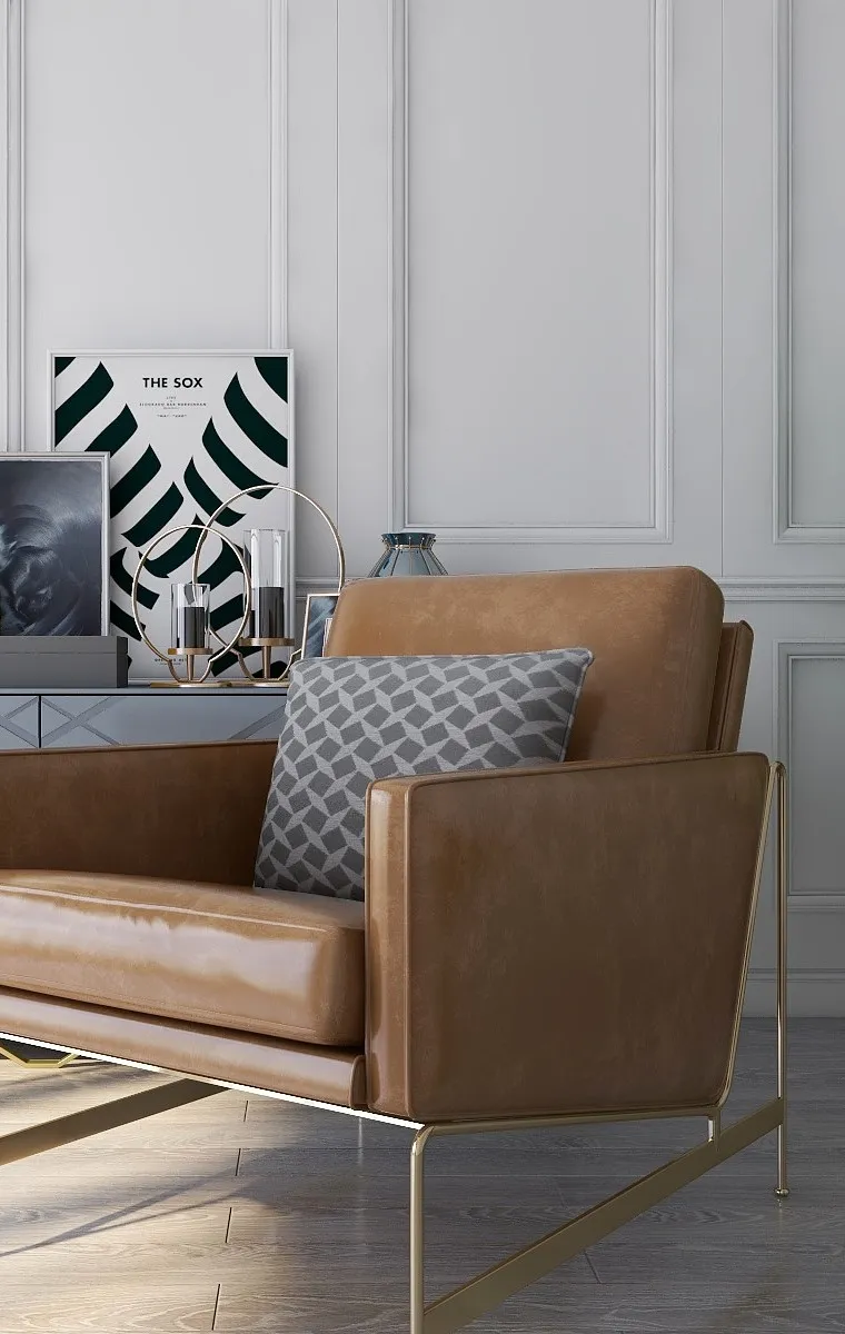 Brown leather chair with patterned pillow near a white wall panel and a grey cabinet