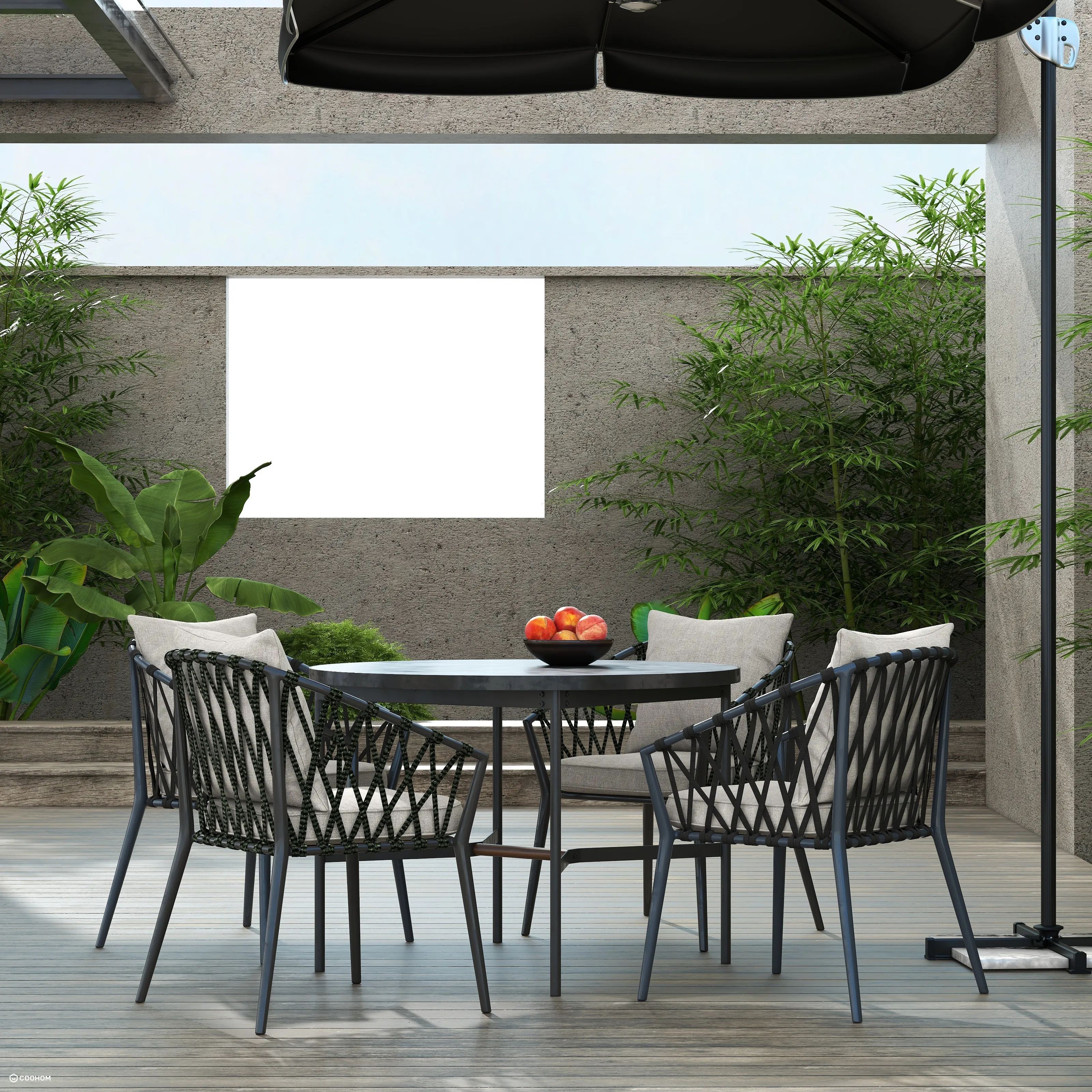 Outdoor patio furniture set with round table black chairs green bamboo and wooden deck floor