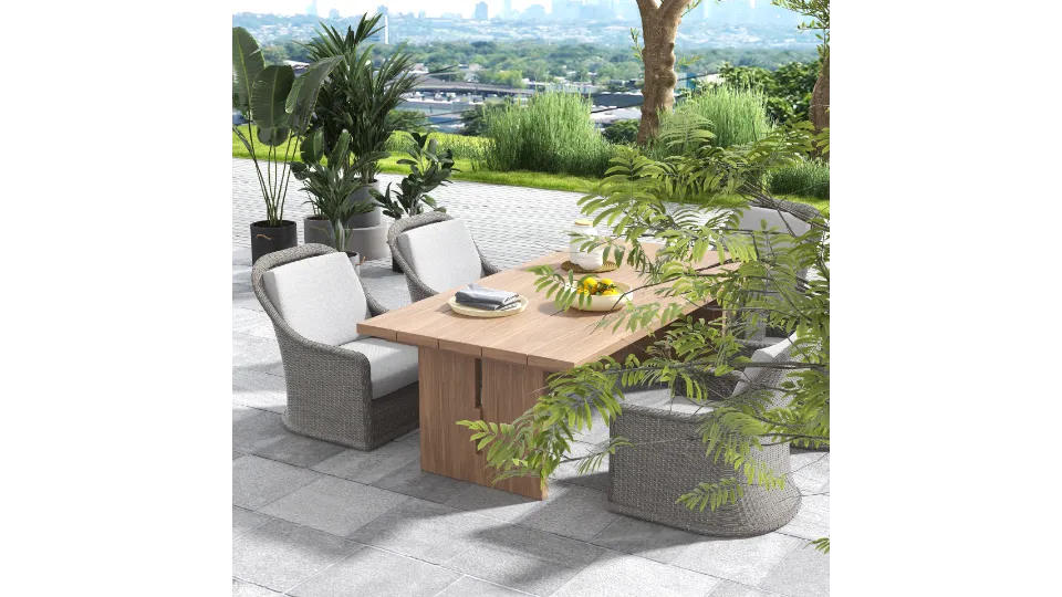 Wooden table and grey chairs with white cushions on a patio with a city view