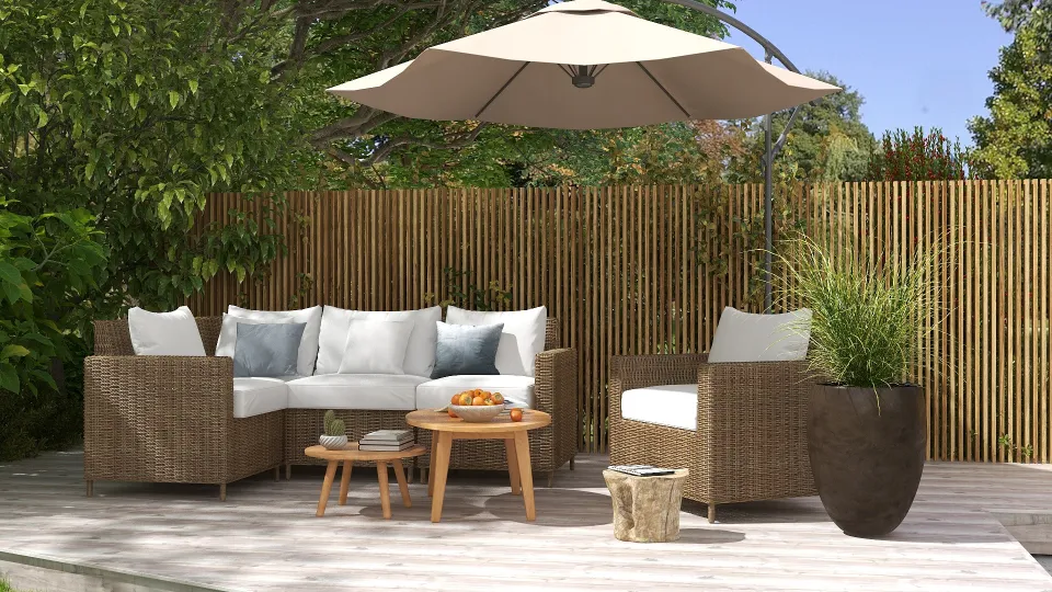 Outdoor patio design with wicker sofa white cushions wood table large umbrella and wood fence