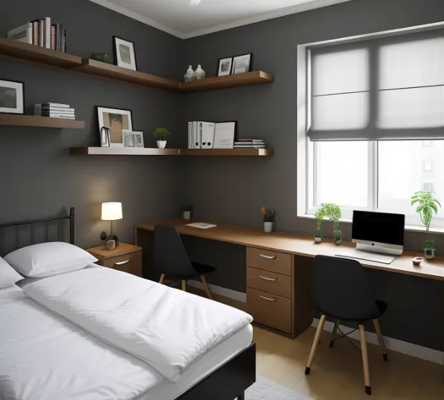 Modern bedroom and workspace with grey walls long wooden desk two chairs and wall shelves